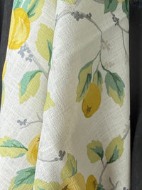 Fabric with lemon and leaf pattern on a white background