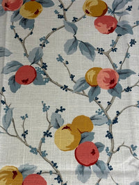 Fabric with a pattern of fruit and leaves on a neutral background