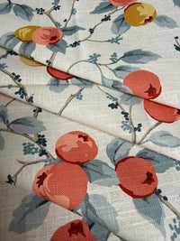 Fabric with pomegranate and leaf pattern on a neutral background