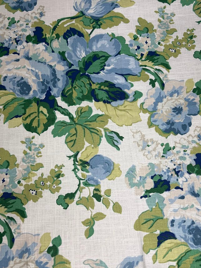 Floral pattern with blue and green flowers on a white background