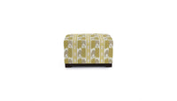 ottoman in fabric featuring a yellow geometric pattern with flame stitch design