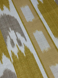 close up of fabric featuring a yellow geometric pattern with flame stitch design