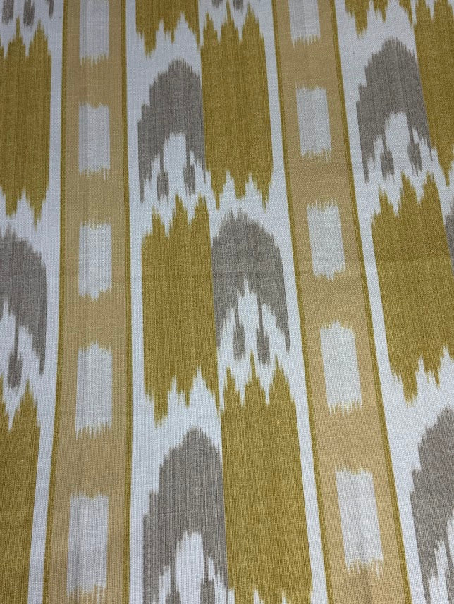 fabric featuring a yellow geometric pattern with flame stitch design