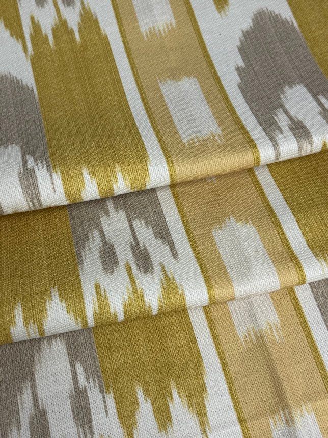 fabric featuring a yellow geometric pattern with flame stitch design