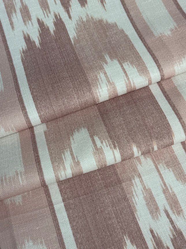 fabric featuring a vertical flame stitch pattern with geometric designs in pink and white colors 