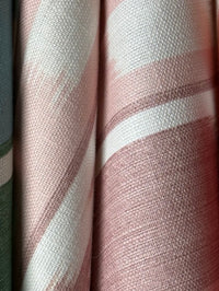 Close-up of striped fabric with pink and white pattern
