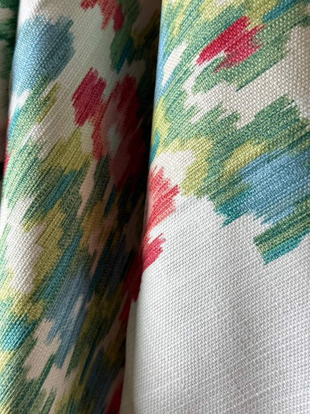 Close-up of colorful fabric with abstract pattern on a white background