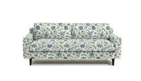 sofa in fabric featuring a floral pattern with blue and green colors on a white background.