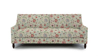 sofa in fabric featuring a floral pattern with peony flowers in pink and red colors on a beige background.