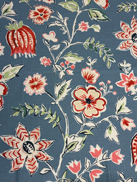 Floral pattern with red, pink, and green flowers on a blue background