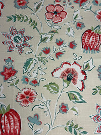 Floral patterned fabric with red, green, and blue flowers on a beige background