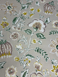A fabric with a floral pattern featuring thistles in lavender, purple, and linen colors on a linen background.