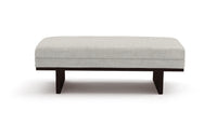 Birch upholstered riley bench with dark wooden legs on a white background
