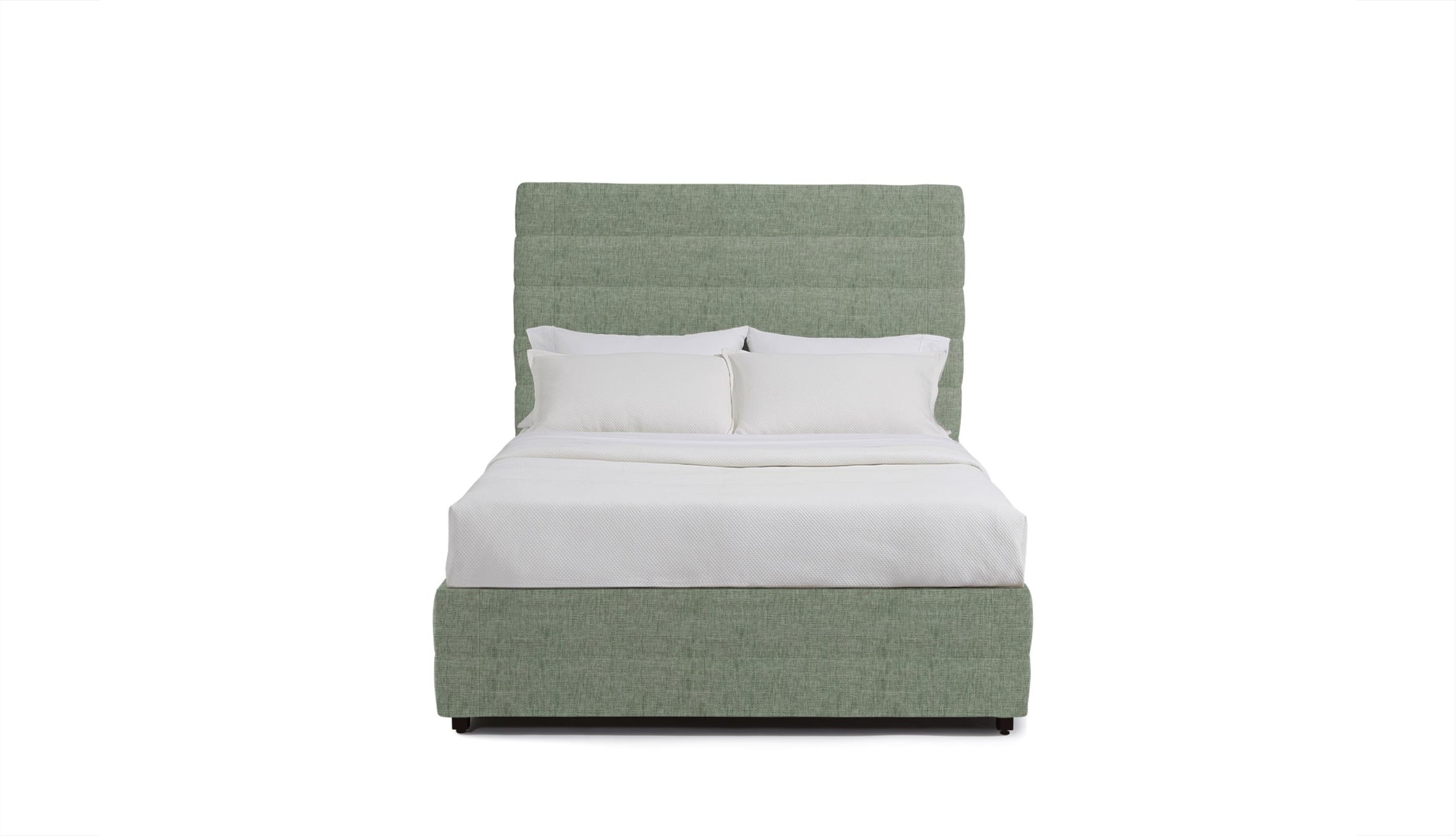 Green upholstered stanford bed with white bedding on a white background