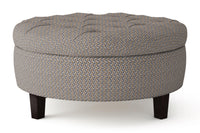 Round patterned morgan ottoman with dark wood legs on a white background