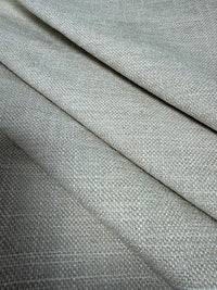 Close-up of cornsilk fabric with a subtle pattern