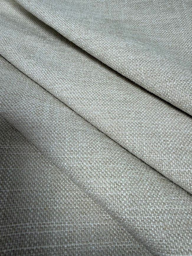 Close-up of cornsilk fabric with a subtle pattern